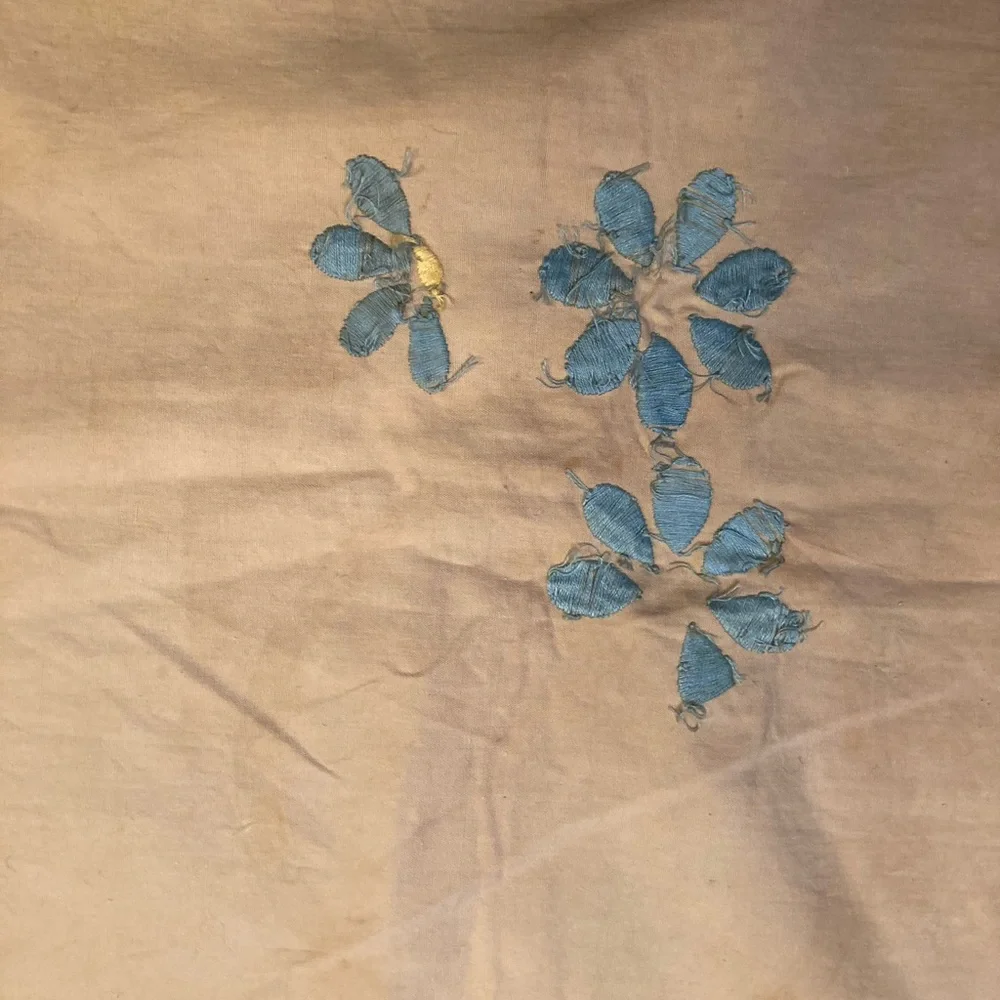 Vintage embroidery muslin, three corners begun, one ink outline blue pink red